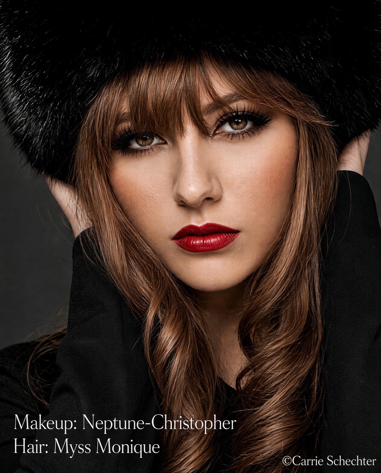 Editorial beauty portrait with luminous complexion, sculpted eye makeup and deep red lip