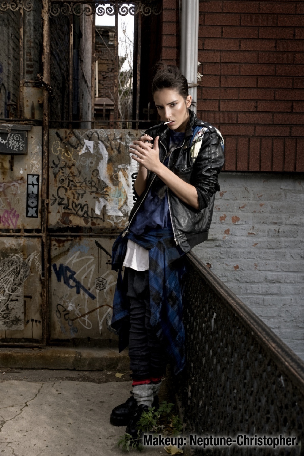 Urban fashion editorial with groomed skin and a softly sculpted eye